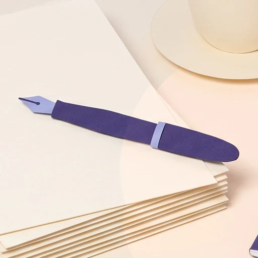 A violet fountain pen on a stack of blank pages