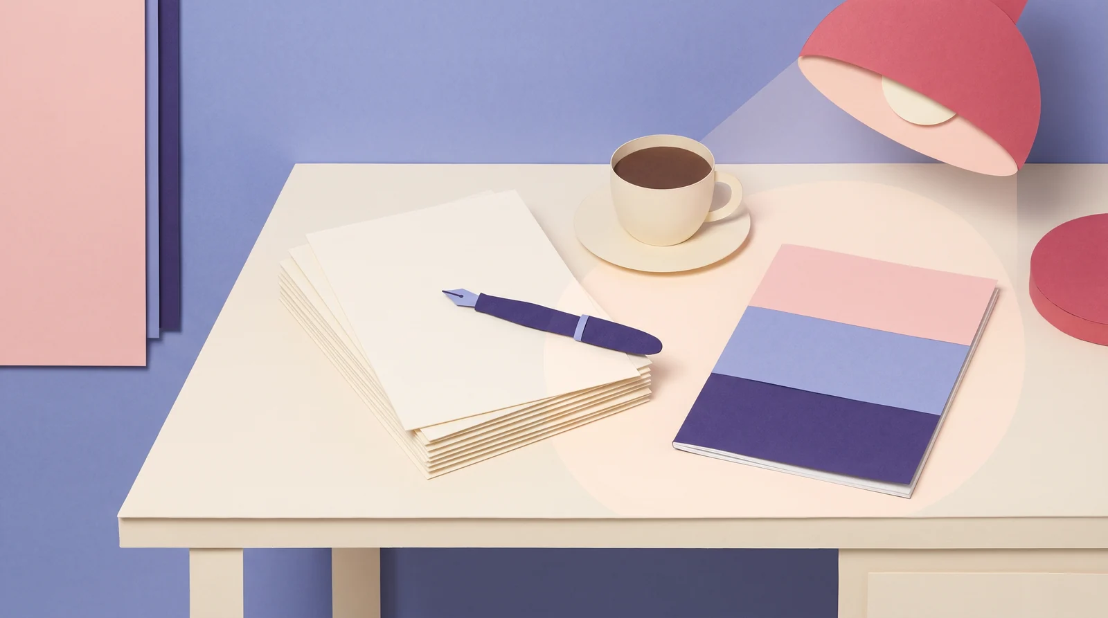 A writing desk made of cut paper: a stack of blank pages with a violet fountain pen, a cup of coffee, a red desk lamp and a slim magazine whose cover is three bands of pink, periwinkle and violet